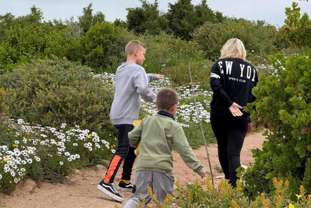 A family walking through the West Coast fynbos